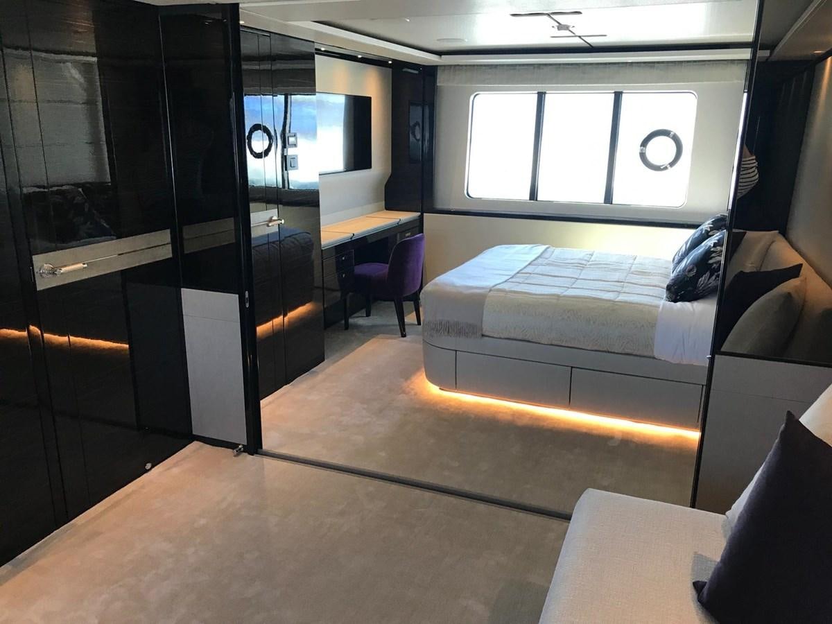 a room with a couch and a window aboard THE SPIRIT OF ELIJAH Yacht for Sale