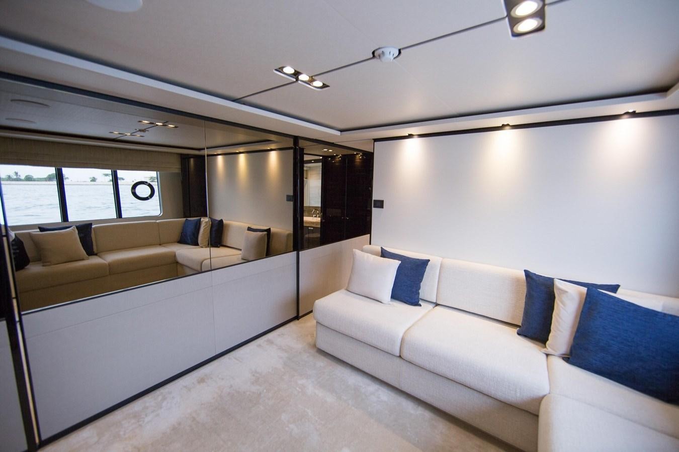 a room with a couch and a table aboard THE SPIRIT OF ELIJAH Yacht for Sale