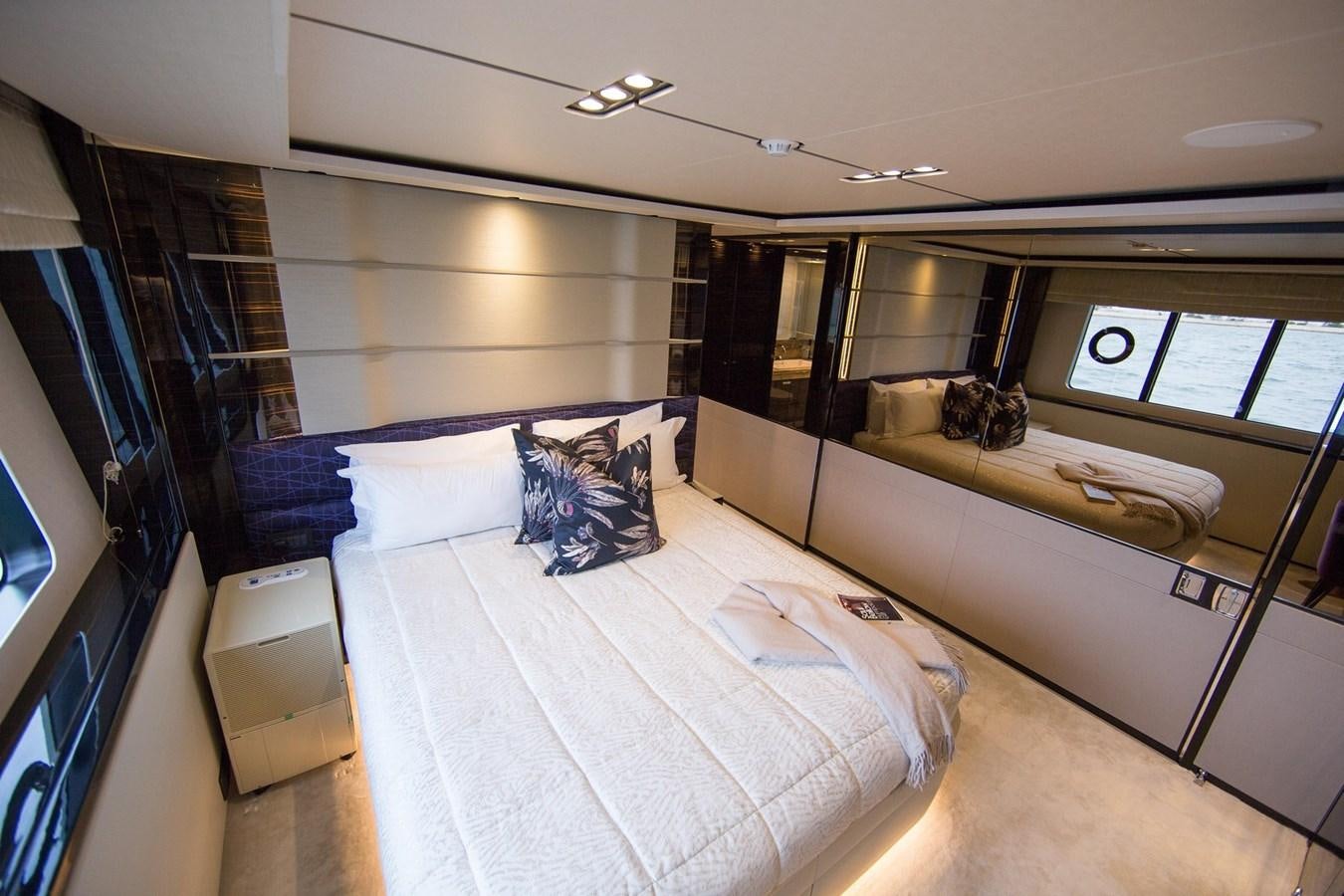 a room with a bed and a television aboard THE SPIRIT OF ELIJAH Yacht for Sale