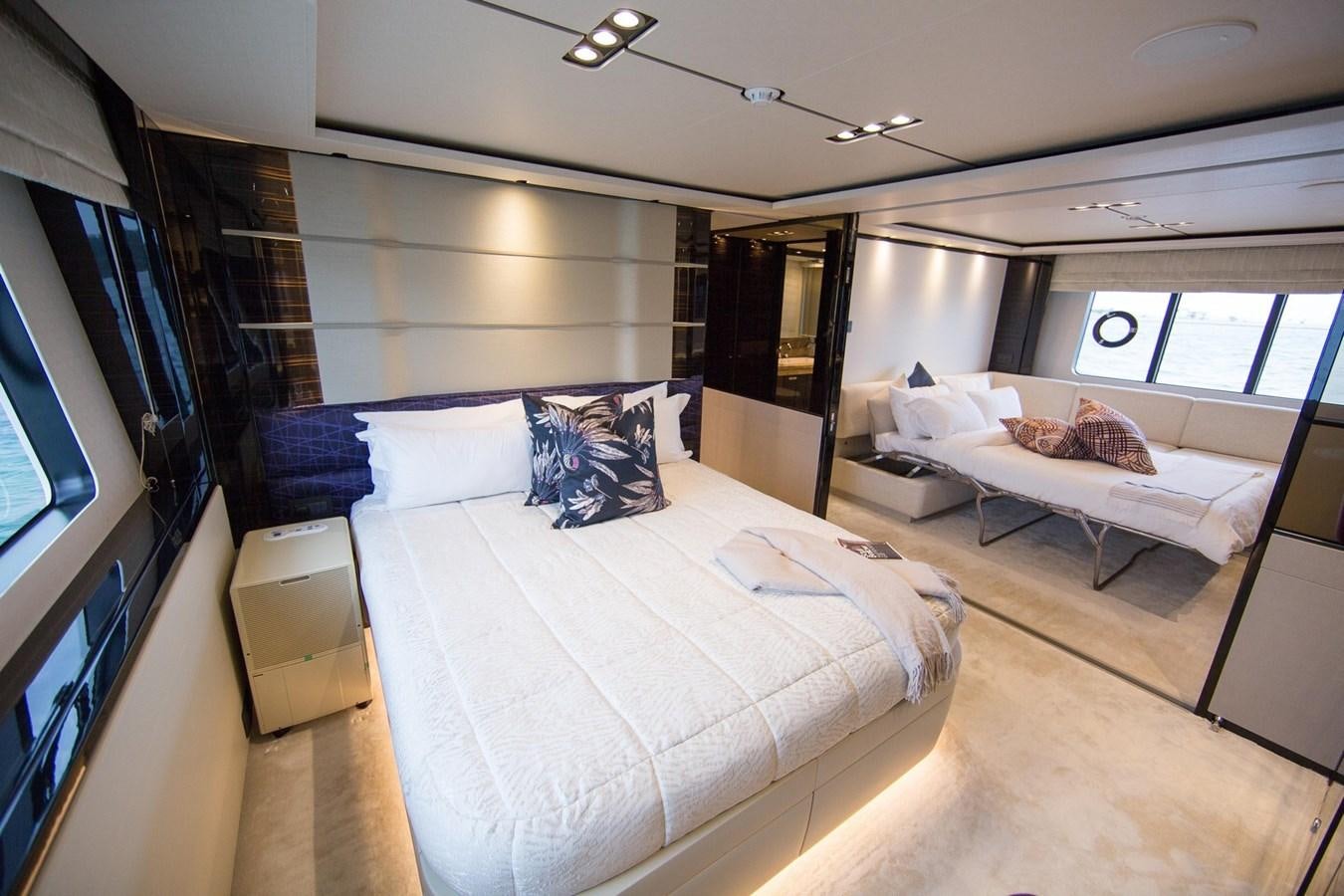 a room with a bed and a television aboard THE SPIRIT OF ELIJAH Yacht for Sale