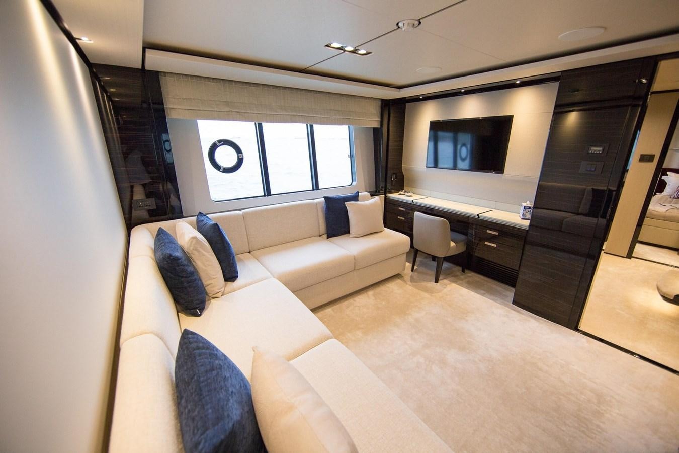 a living room with a couch and a tv aboard THE SPIRIT OF ELIJAH Yacht for Sale