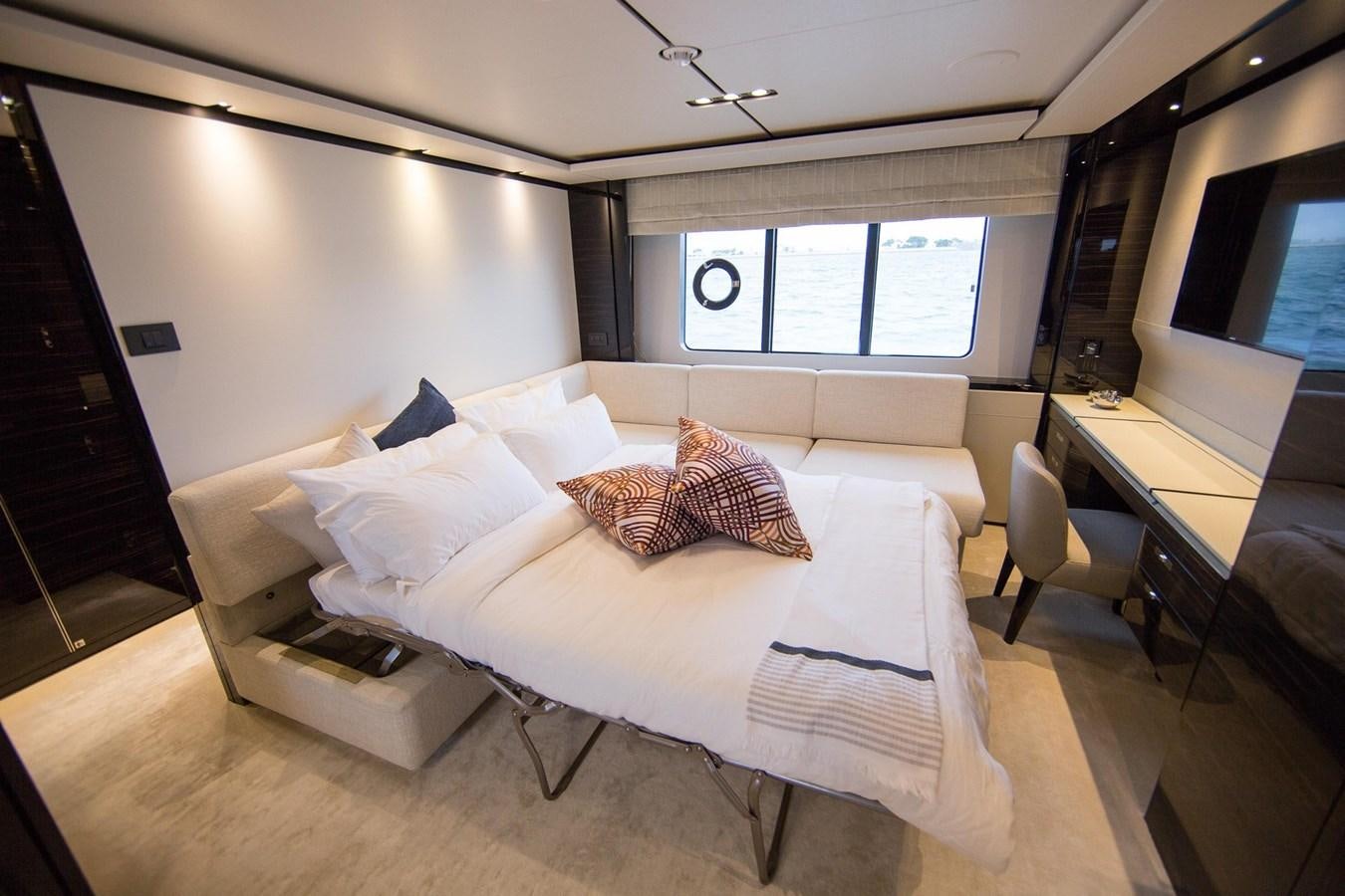a room with a bed and a desk aboard THE SPIRIT OF ELIJAH Yacht for Sale