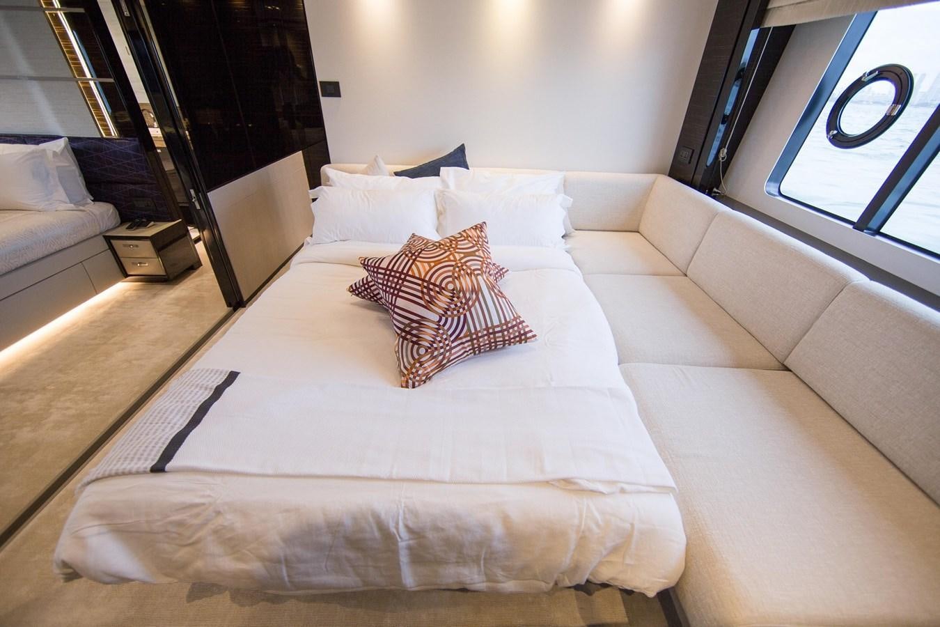 a bed with a white sheet and pillows on it aboard THE SPIRIT OF ELIJAH Yacht for Sale