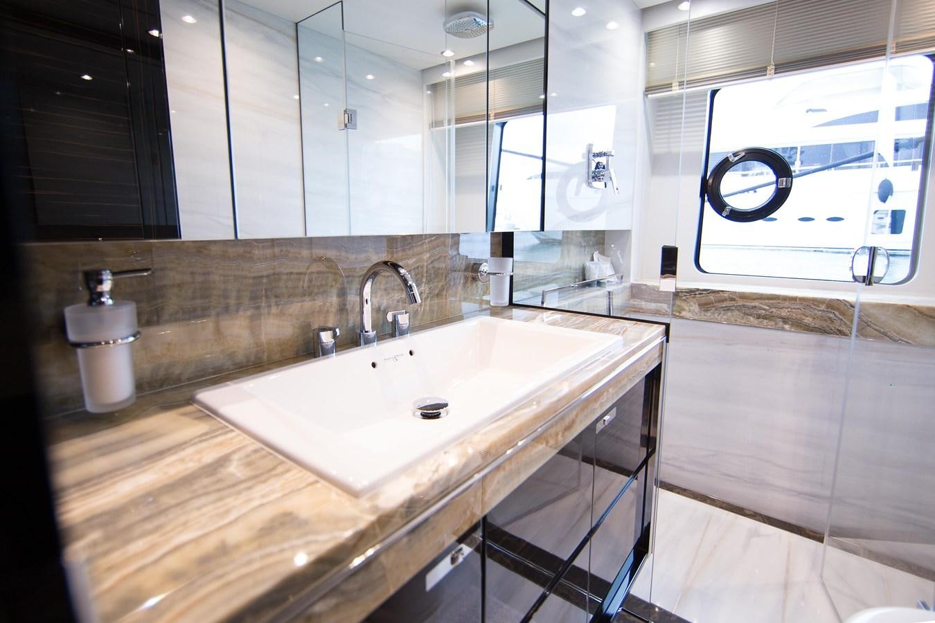 a bathroom with a large mirror aboard THE SPIRIT OF ELIJAH Yacht for Sale