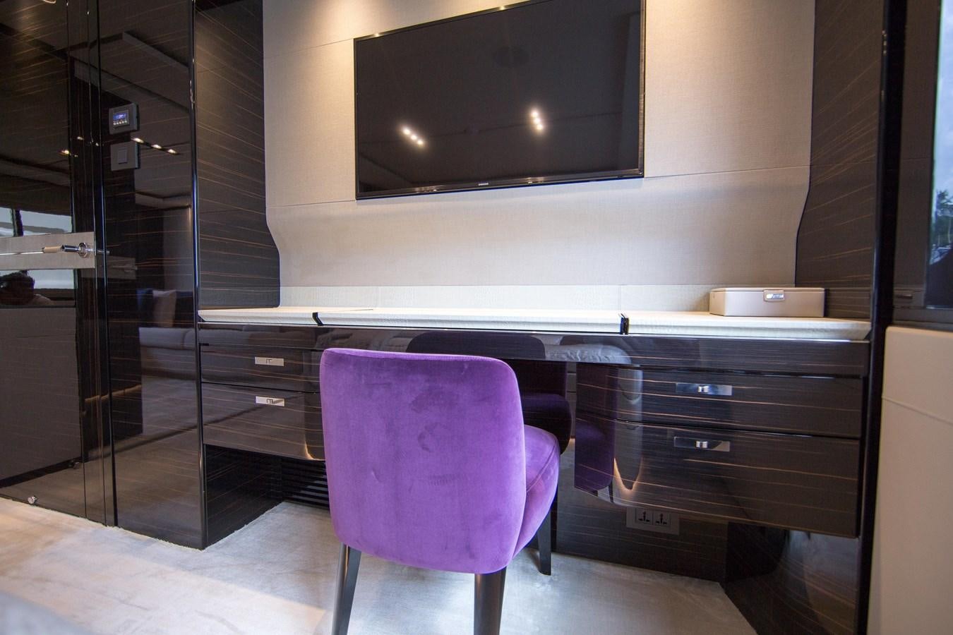 a purple chair in front of a tv aboard THE SPIRIT OF ELIJAH Yacht for Sale