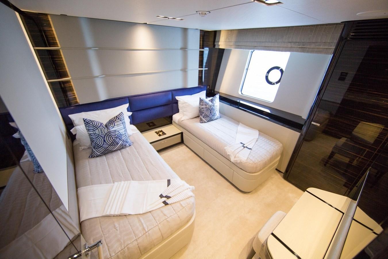 a room with a bed and a window aboard THE SPIRIT OF ELIJAH Yacht for Sale