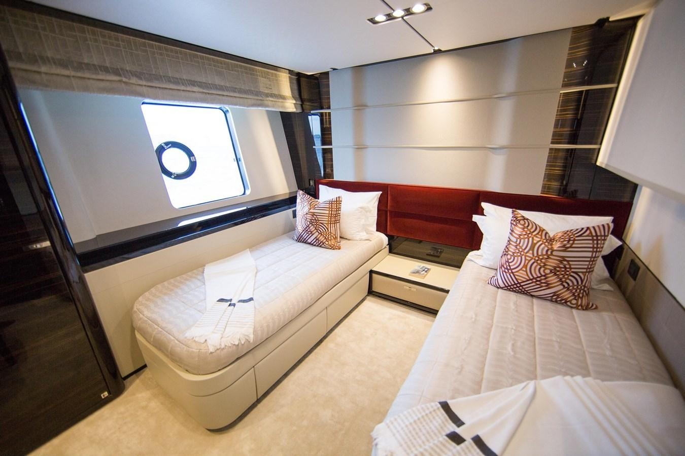 a room with a bed and a window aboard THE SPIRIT OF ELIJAH Yacht for Sale