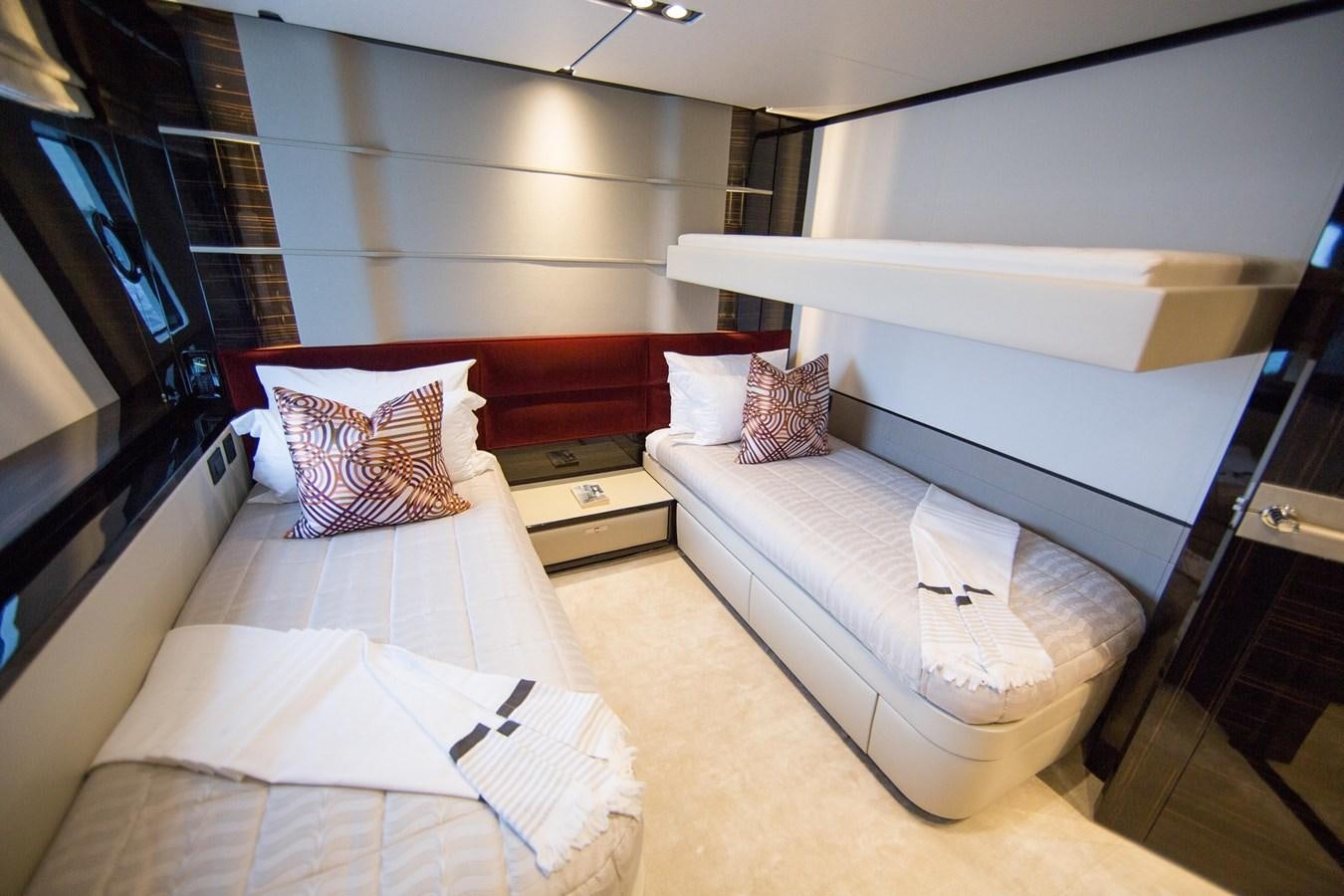 a room with a bed and a desk aboard THE SPIRIT OF ELIJAH Yacht for Sale