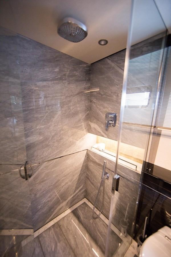 a bathroom with a glass shower aboard THE SPIRIT OF ELIJAH Yacht for Sale