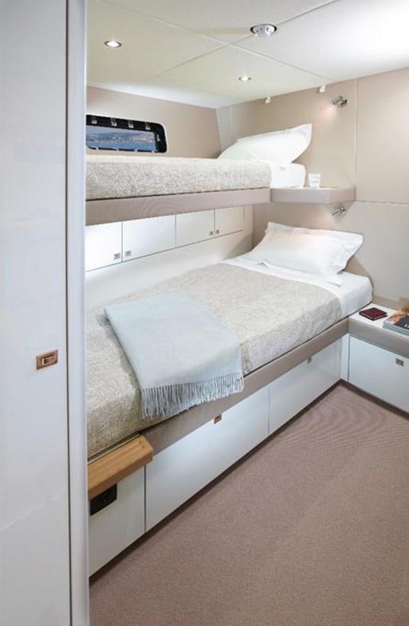 a room with a bed and a shelf aboard THE SPIRIT OF ELIJAH Yacht for Sale