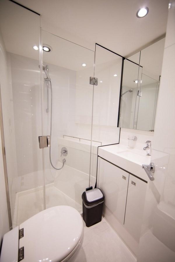 a bathroom with a shower unit and a toilet aboard THE SPIRIT OF ELIJAH Yacht for Sale