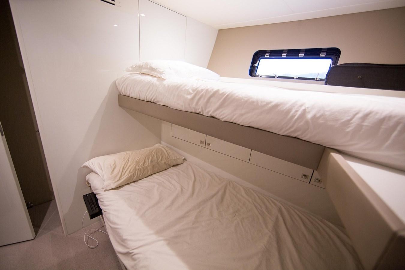 a bed with a white pillow aboard THE SPIRIT OF ELIJAH Yacht for Sale