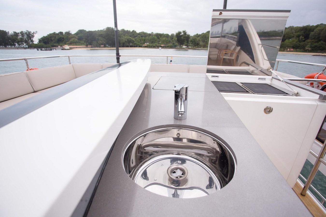 a white car with a large white hood aboard THE SPIRIT OF ELIJAH Yacht for Sale