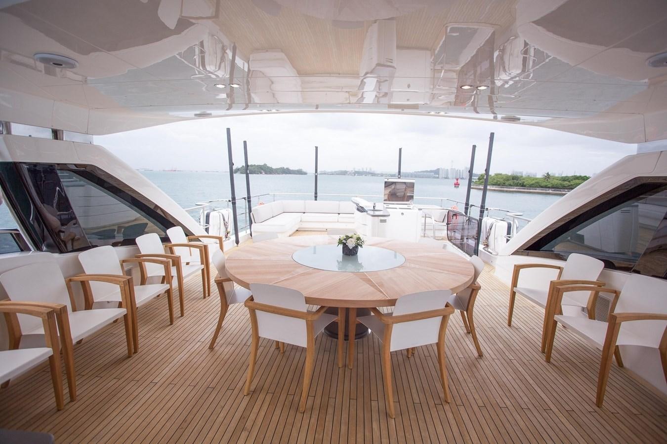 a room with tables and chairs aboard THE SPIRIT OF ELIJAH Yacht for Sale