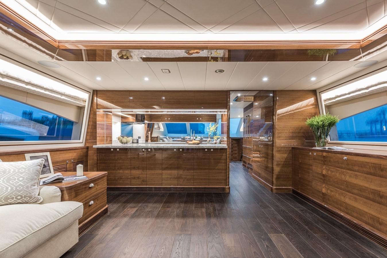 a room with a wood floor and a wood cabinet with drawers aboard E100 (NEW SPEC BOAT)  Yacht for Sale