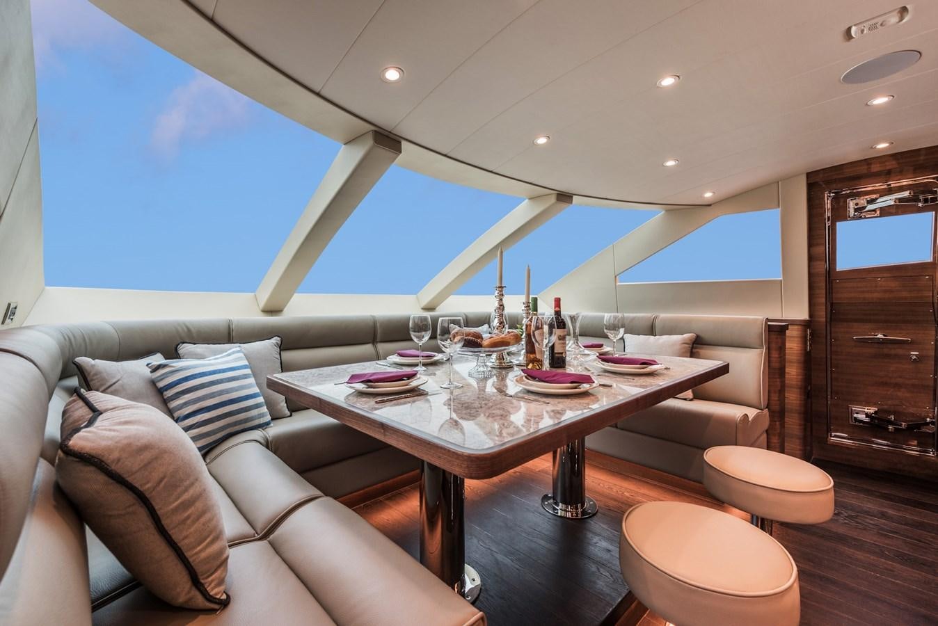 a living room with a table and chairs aboard E100 (NEW SPEC BOAT)  Yacht for Sale