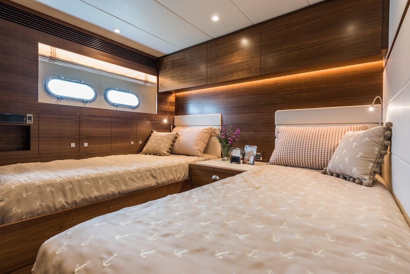 a room with a bed and a wood wall aboard E100 (NEW SPEC BOAT)  Yacht for Sale