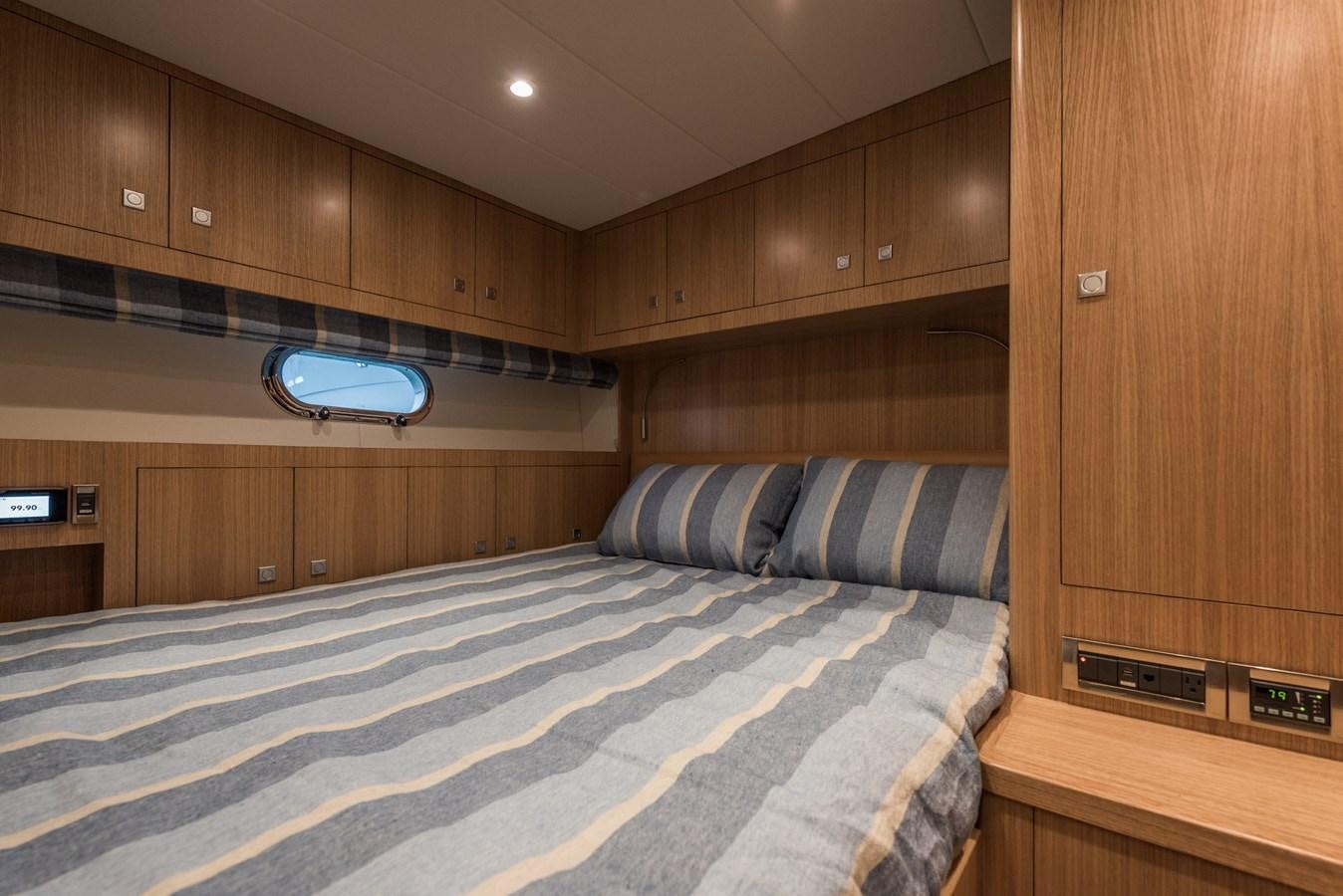 a bed in a room aboard E100 (NEW SPEC BOAT)  Yacht for Sale