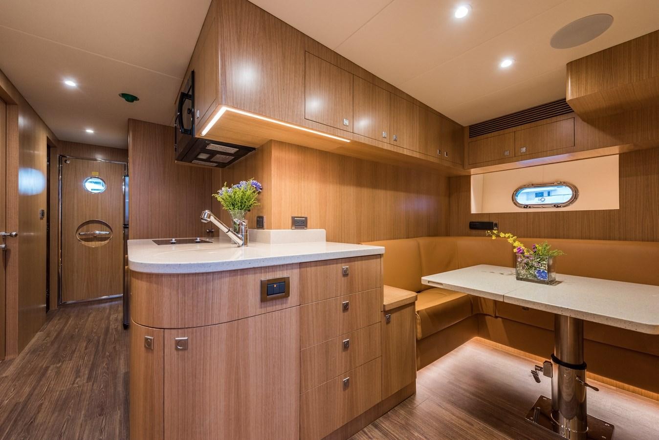 a kitchen with a large island aboard E100 (NEW SPEC BOAT)  Yacht for Sale