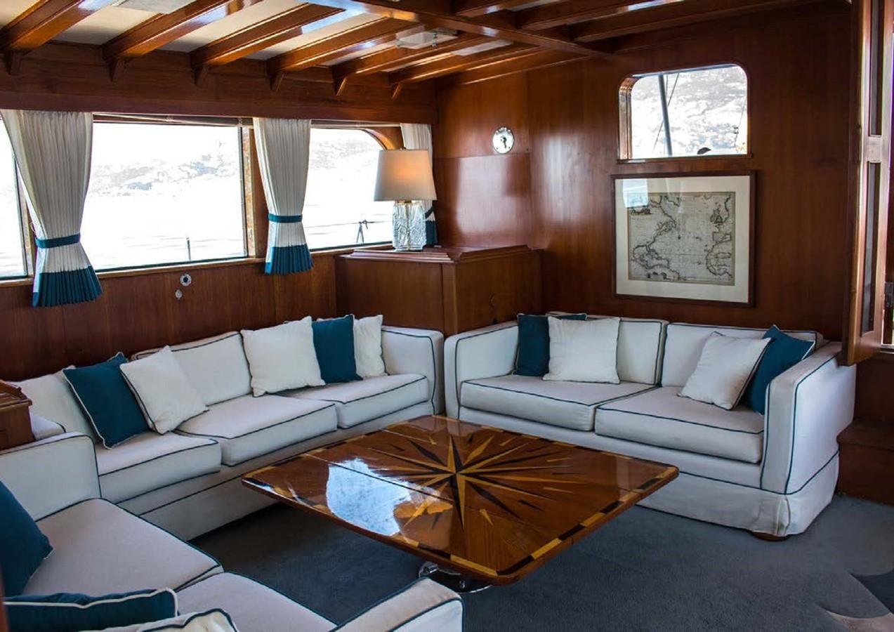 a living room with a couch and a coffee table aboard FEI-SEEN Yacht for Sale