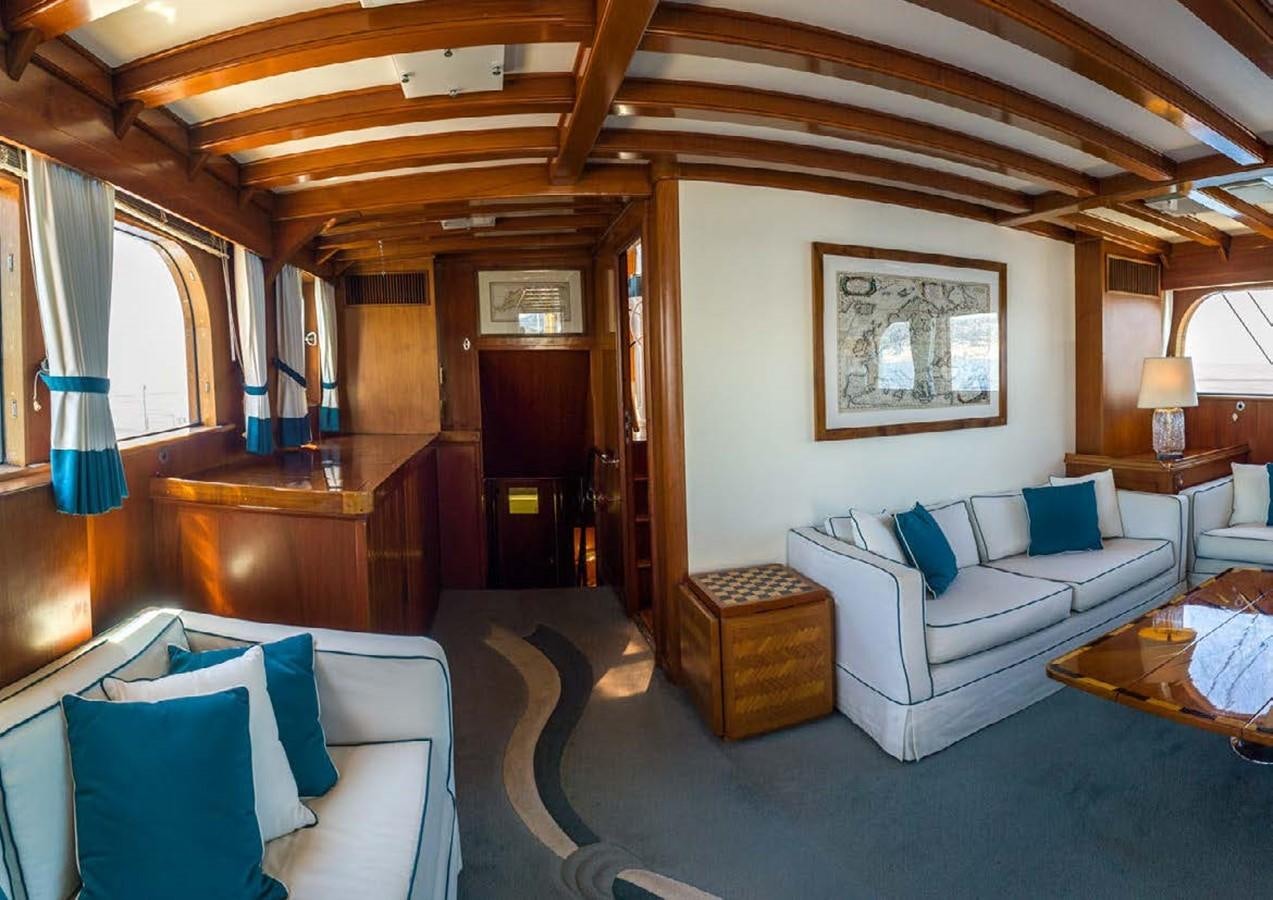 a room with a couch and a table aboard FEI-SEEN Yacht for Sale