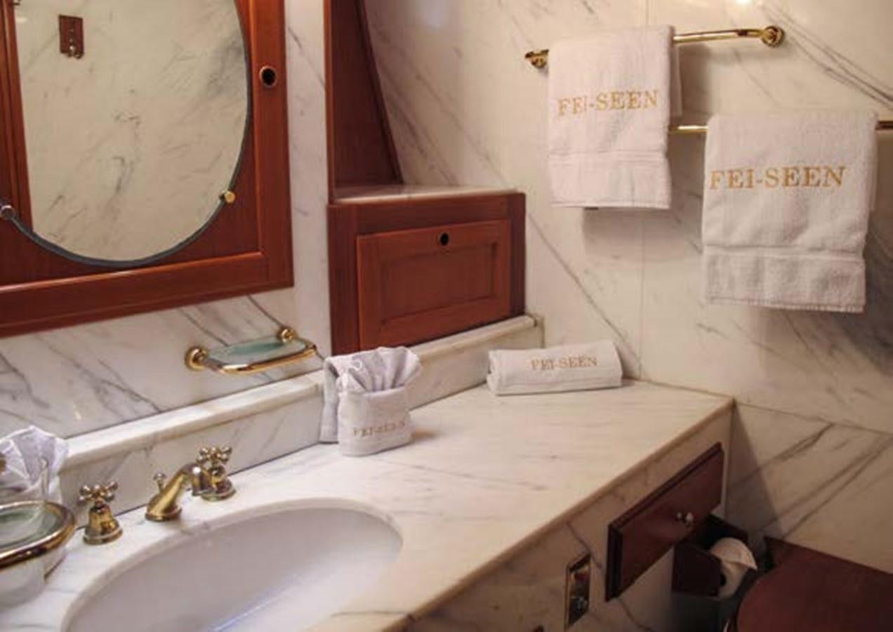 a bathroom with a mirror and towels aboard FEI-SEEN Yacht for Sale