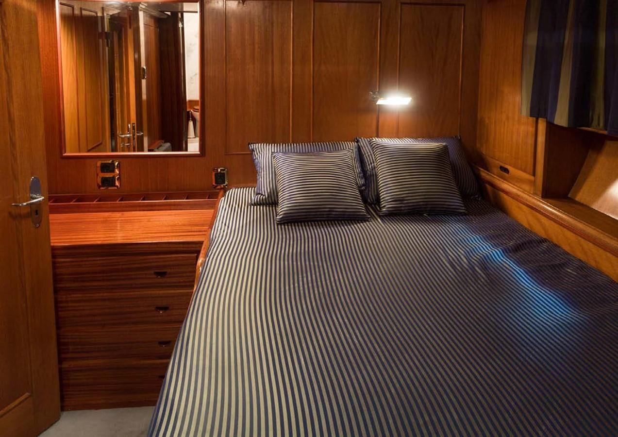 a bed with white sheets aboard FEI-SEEN Yacht for Sale
