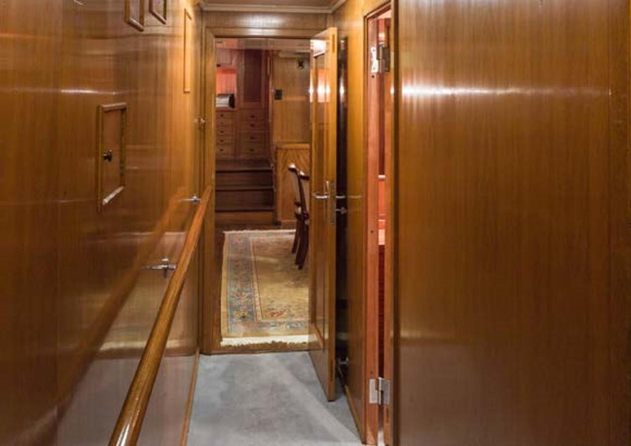 a hallway with a door and a railing aboard FEI-SEEN Yacht for Sale