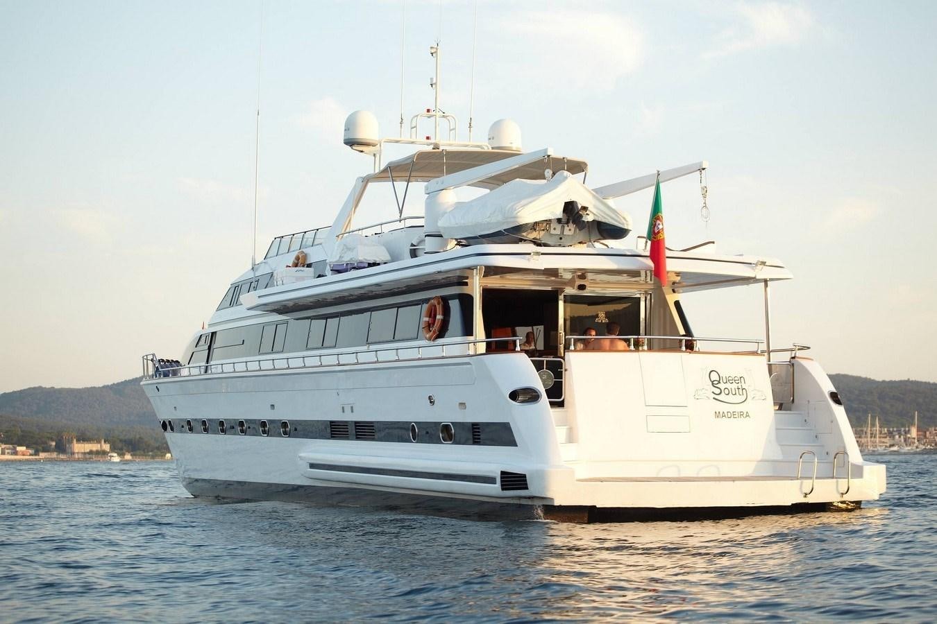 a white boat on the water aboard QUEEN SOUTH Yacht for Charter