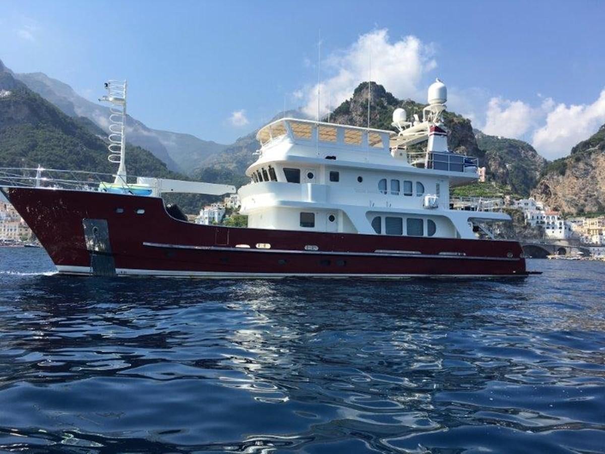 a red and white boat in the water aboard A.B. NORMAL Yacht for Sale