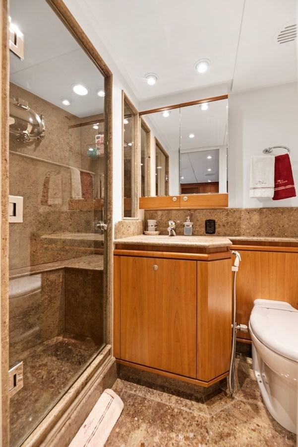 a bathroom with a sink and a toilet aboard A.B. NORMAL Yacht for Sale