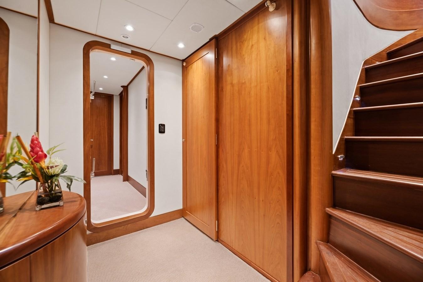 a room with wooden cabinets and a mirror aboard A.B. NORMAL Yacht for Sale