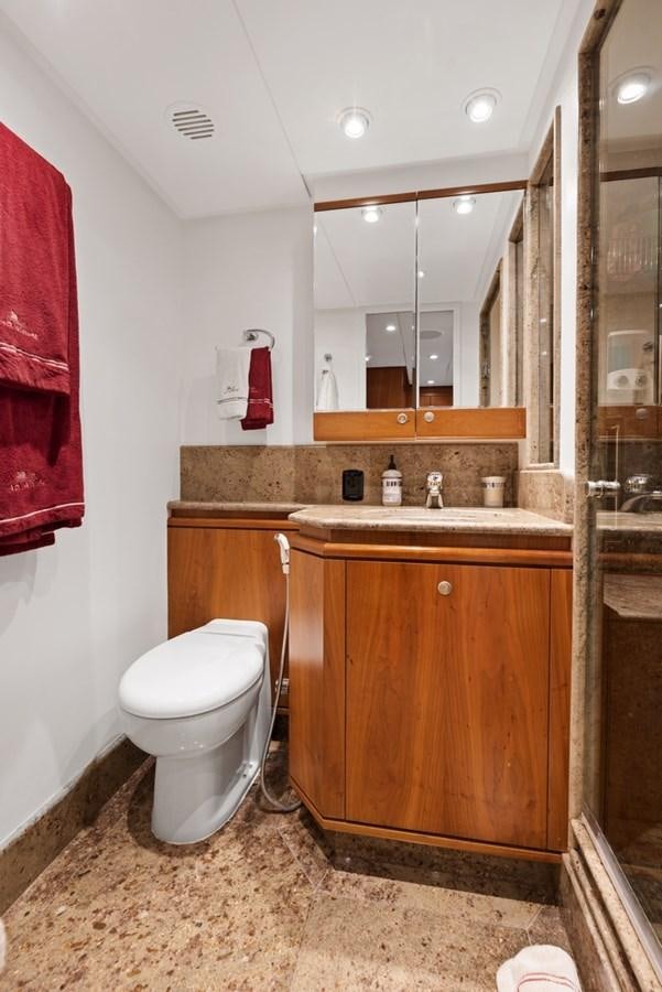a bathroom with a toilet and sink aboard A.B. NORMAL Yacht for Sale