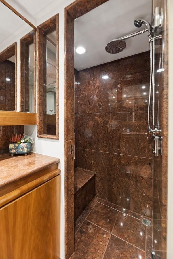 a shower with a stone wall aboard A.B. NORMAL Yacht for Sale