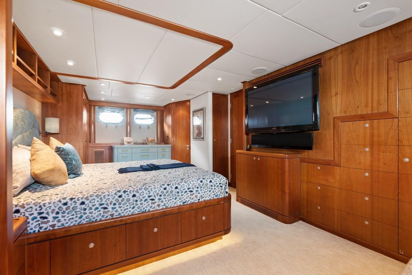 a bedroom with a bed and a tv aboard A.B. NORMAL Yacht for Sale
