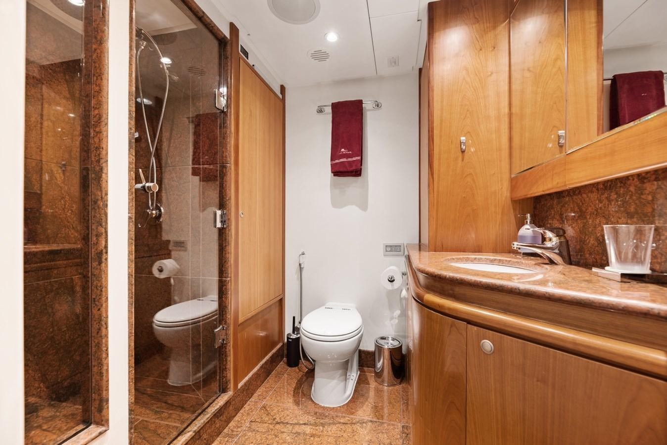 a bathroom with a toilet and sink aboard A.B. NORMAL Yacht for Sale