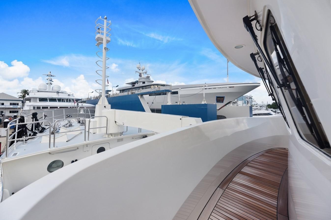 a large white boat with a blue roof aboard A.B. NORMAL Yacht for Sale