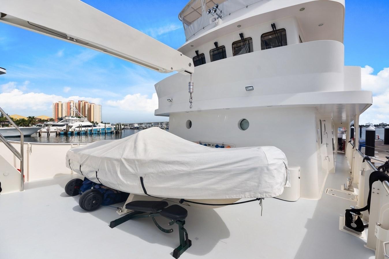 a large white boat on a trailer aboard A.B. NORMAL Yacht for Sale