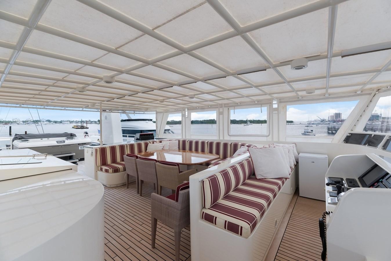 a boat with a table and chairs aboard A.B. NORMAL Yacht for Sale