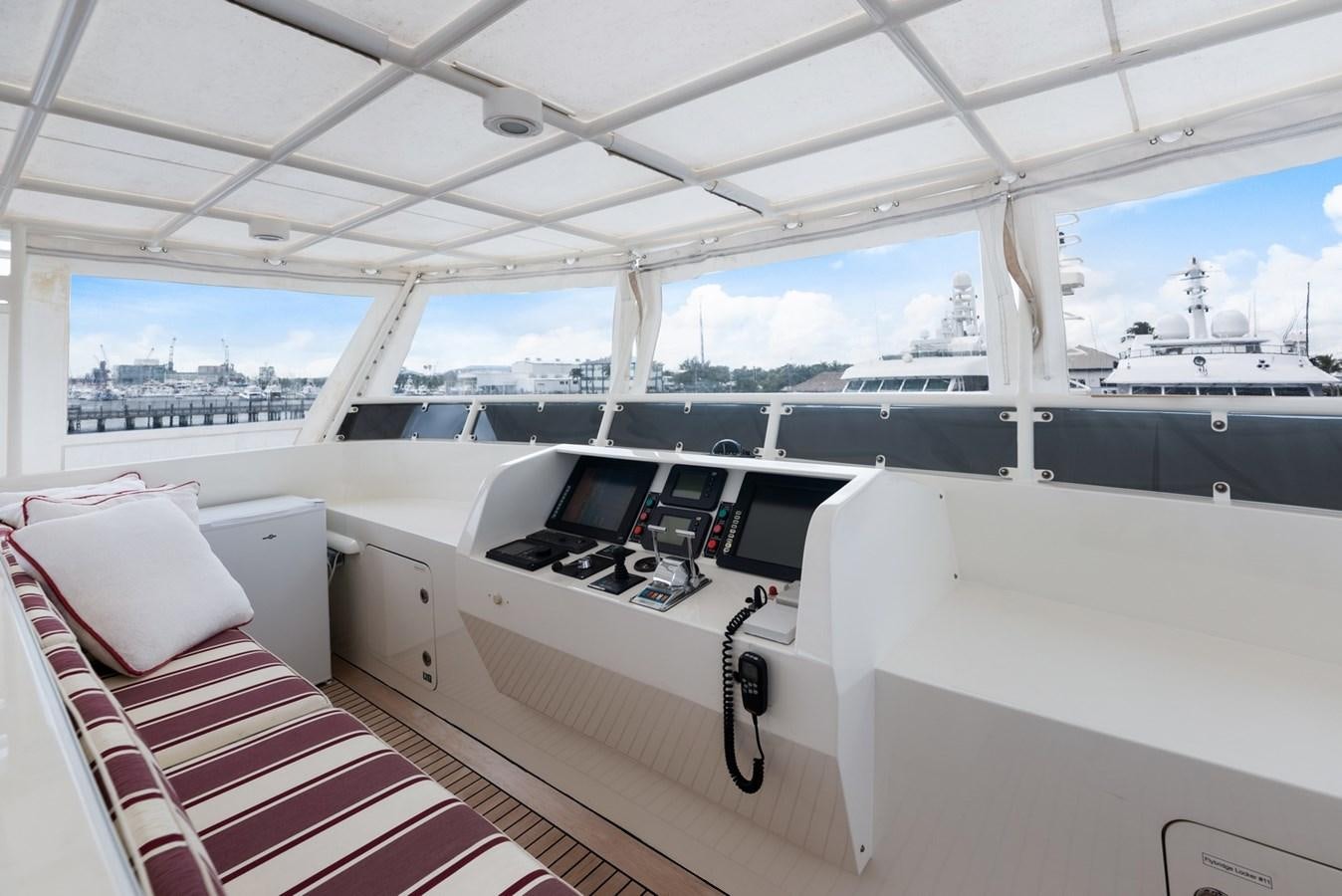 a room with a bed and a desk with a laptop on it aboard A.B. NORMAL Yacht for Sale