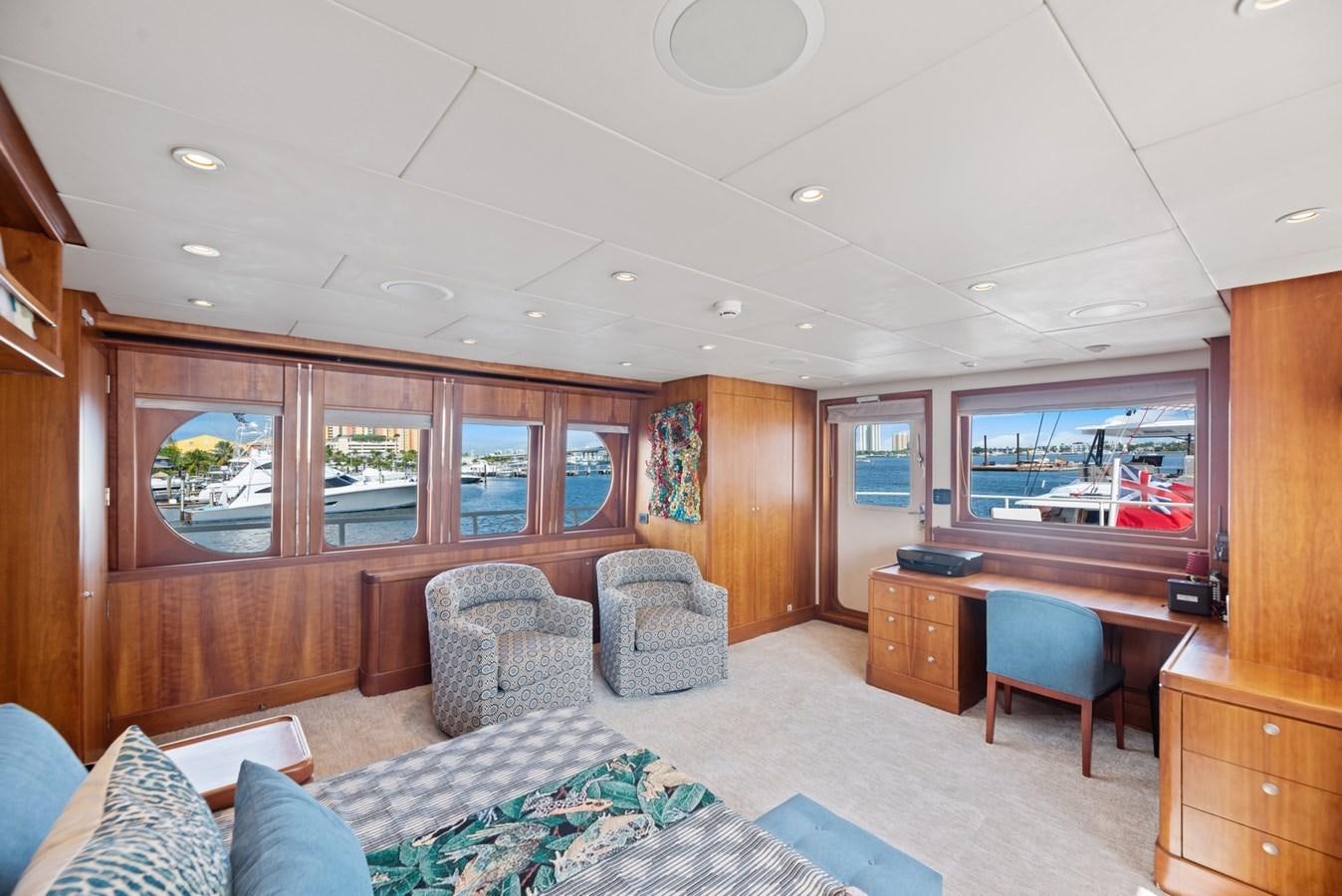 a bedroom with a bed and desk aboard A.B. NORMAL Yacht for Sale