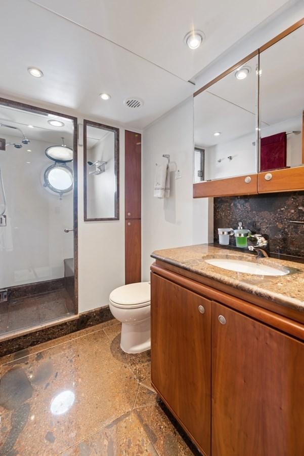 a bathroom with a sink and a toilet aboard A.B. NORMAL Yacht for Sale