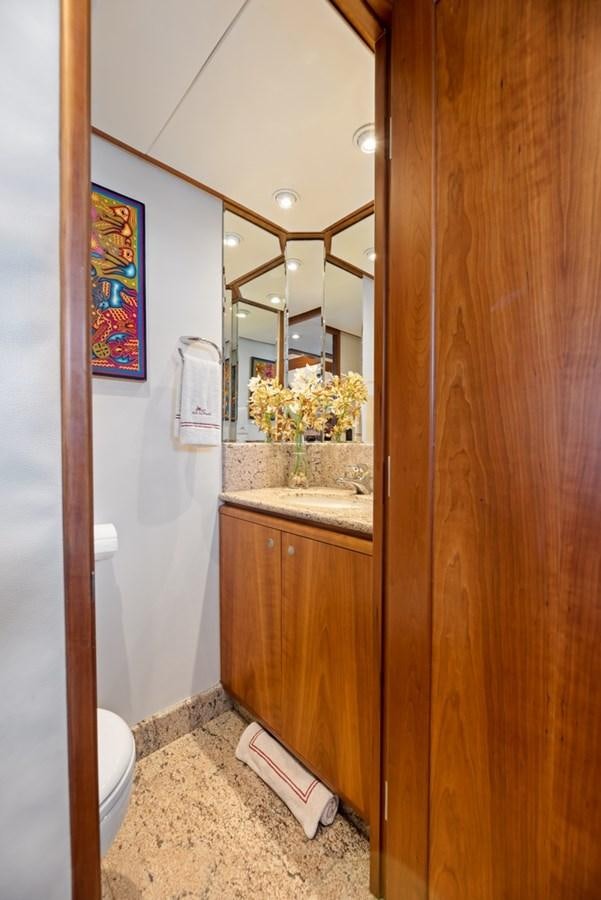 a bathroom with a sink and a mirror aboard A.B. NORMAL Yacht for Sale
