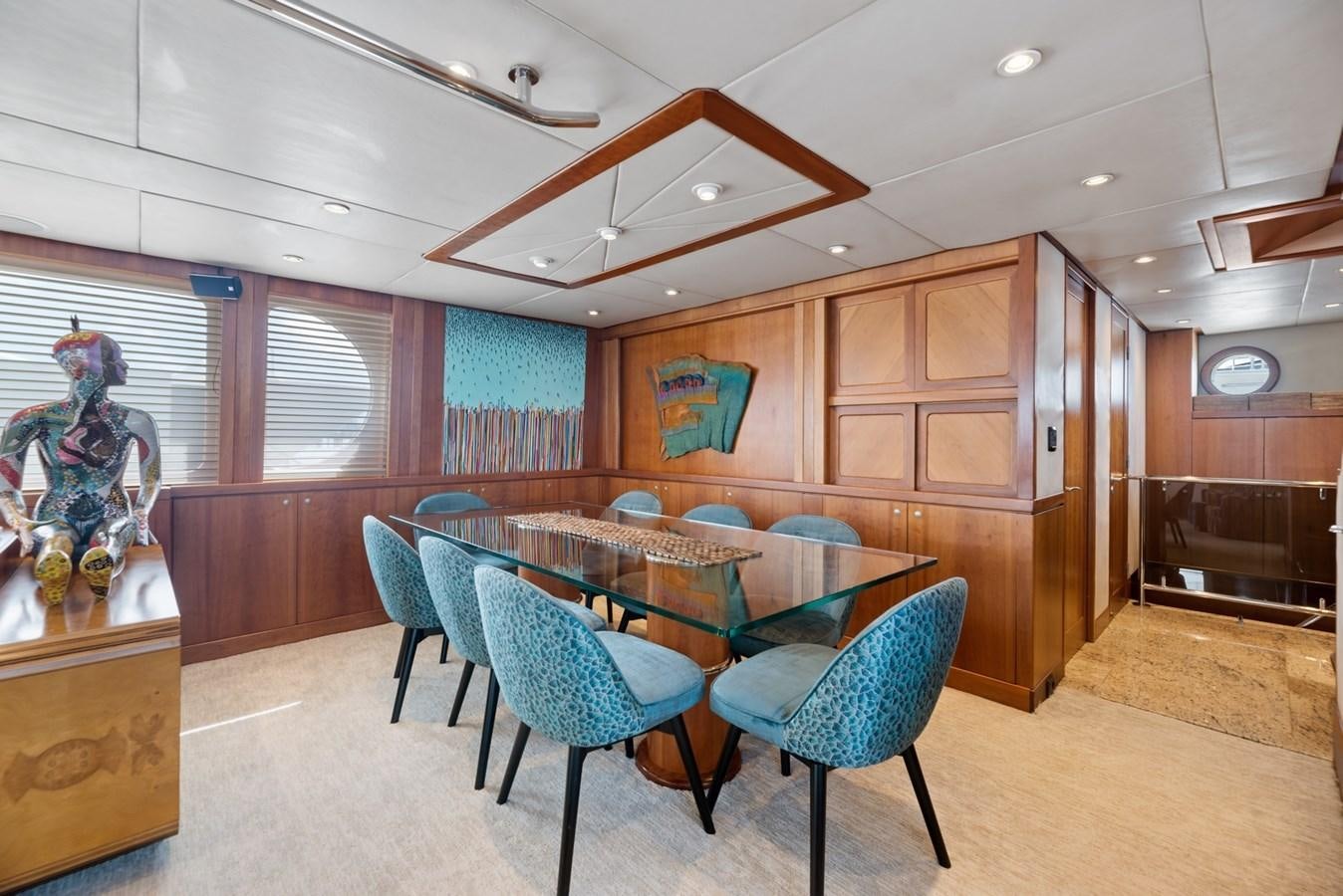a room with a table and chairs aboard A.B. NORMAL Yacht for Sale