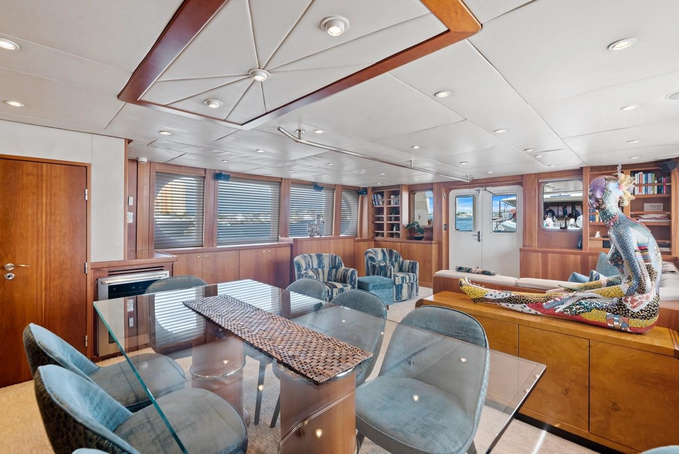 a room with chairs and a table aboard A.B. NORMAL Yacht for Sale