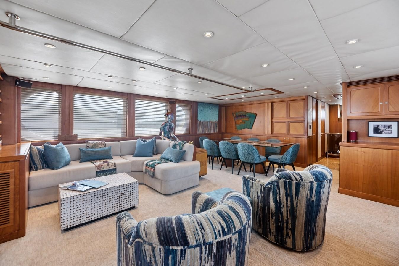 a room with a couch and chairs aboard A.B. NORMAL Yacht for Sale
