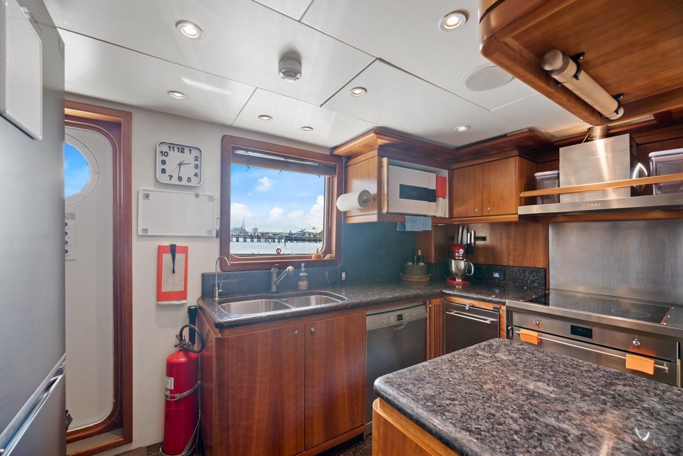 a kitchen with a large island aboard A.B. NORMAL Yacht for Sale