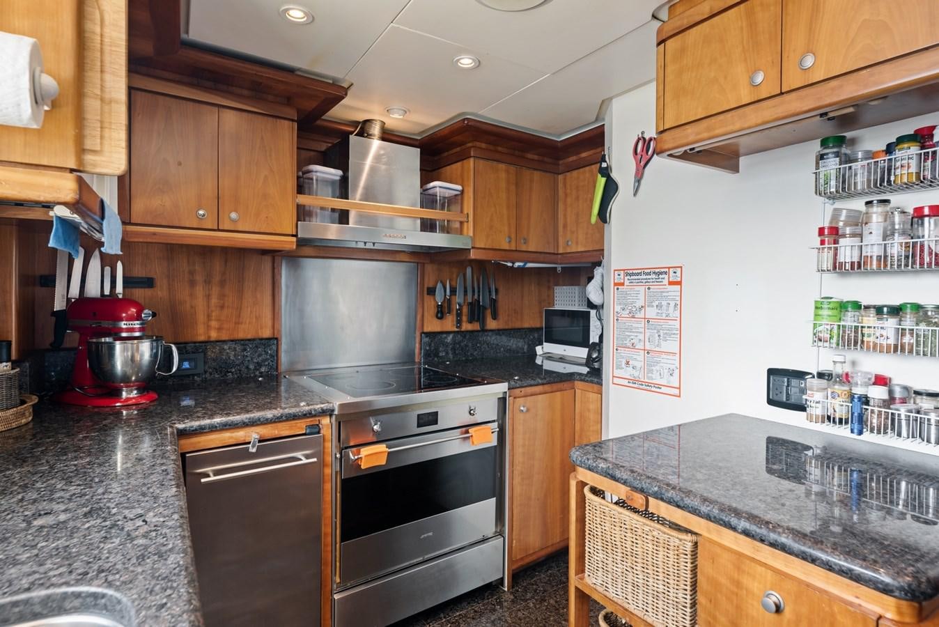 a kitchen with a stove and a refrigerator aboard A.B. NORMAL Yacht for Sale