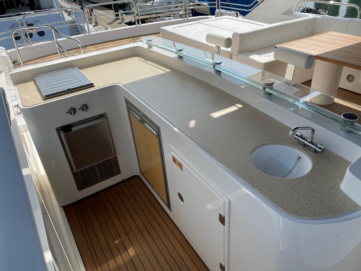 a kitchen with a sink and a microwave aboard SUNSEEKER 30M Yacht for Sale