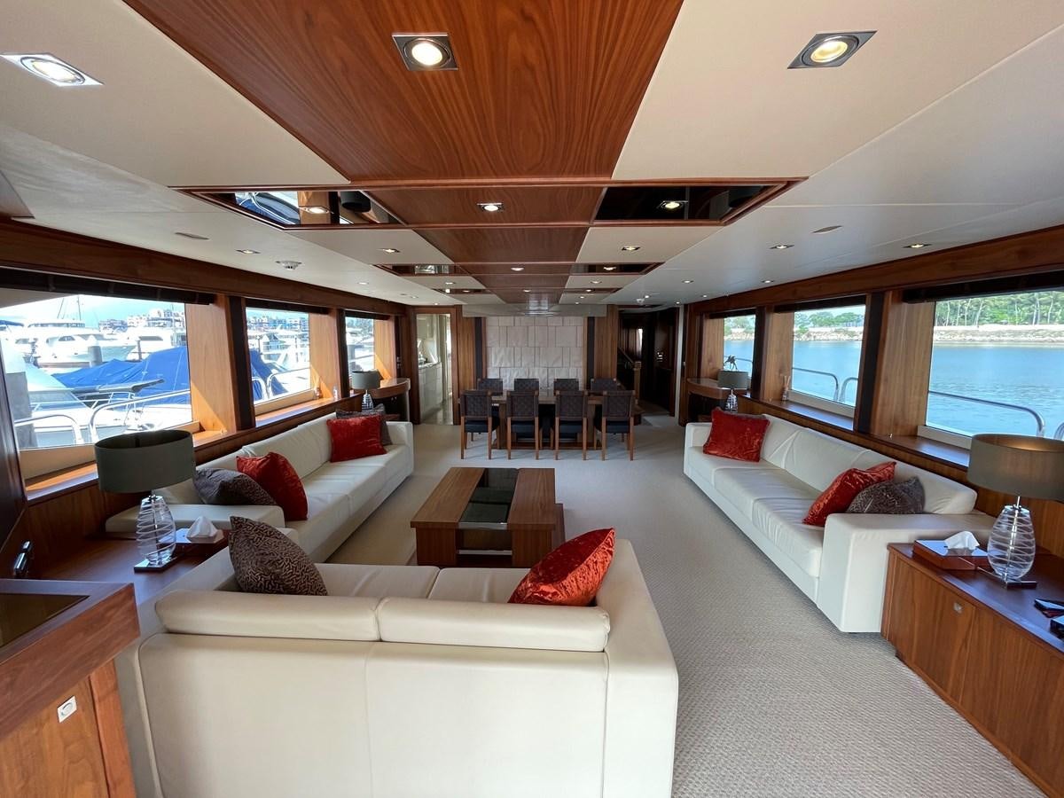 a living room with a large window aboard SUNSEEKER 30M Yacht for Sale